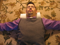 When lying on the rolled towel for neck and headache relief, lower your arms if your fingers begin to tingle.