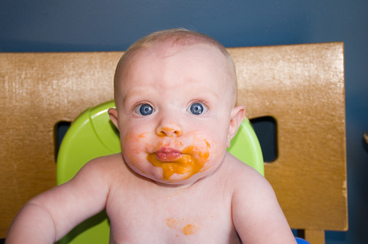 Child with baby food
