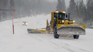 A plow on a snowy road