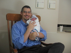 Dr. Kyle Johnson of Johnson Family Chiropractic of Peoria and his new daughter.